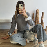 Pull torsadé gris